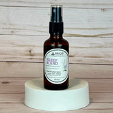 sleep blend room and linen spray Brown spray bottle labeled 'Sleep Blend' by Brigid on a wooden surface.