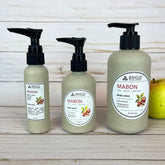 mabon body lotion 2 ounce 4 ounce 8 ounce two four eight in eco pump bottles wheat straw black tops natural hand mixed harvest moon festival gifts for mom girlfriend pagan christian catholic presents for fall autumn apples apple cinnamon apple pie scented fresh apples harvest spices image of bottles on wooden backdrop with fresh green and red apple