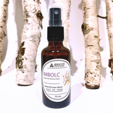 imbolc room and linen spray natural fragrance for imbolc cross of brigid celtic culture for home relaxation aromatherapy grade premium fragrance pthalate paraben free rose heather daffodil narcissus vetiver fragrance blend floral fresh spring scent photo shows spray in glass amber bottle with white birch background