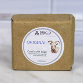 goats milk soap natural by brigid trading company lughnasadh scent hand milled shows a bar of unscented natural goat milk soap on a neutral background kitsap county washington state