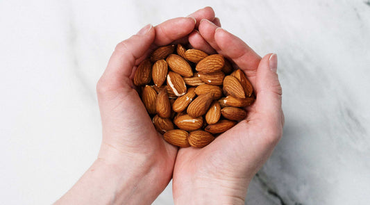 sweet almond oil hands with almonds used with permission pexels photo by cottonbro studio