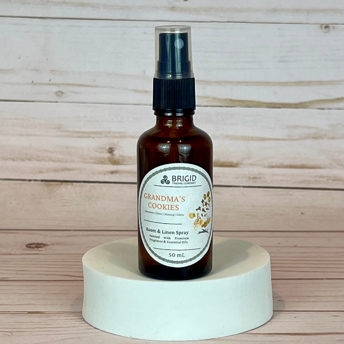 grandma's cookies room and linen spray Bottle of 'Grandma's Cookies' room & linen spray by Brigid on a wooden background
