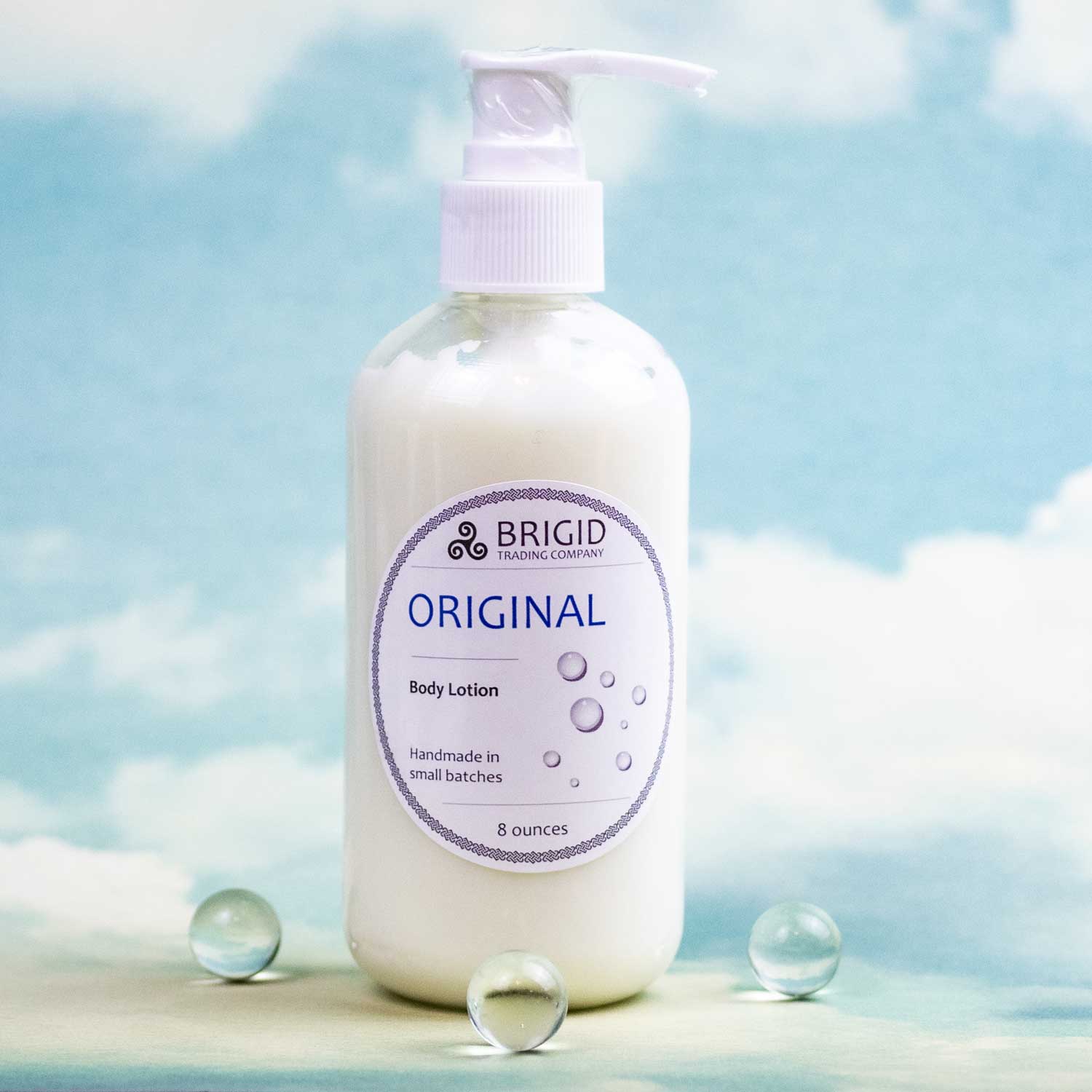 brigid original body lotion on cloud background studio photography original photo by brigid trading company llc