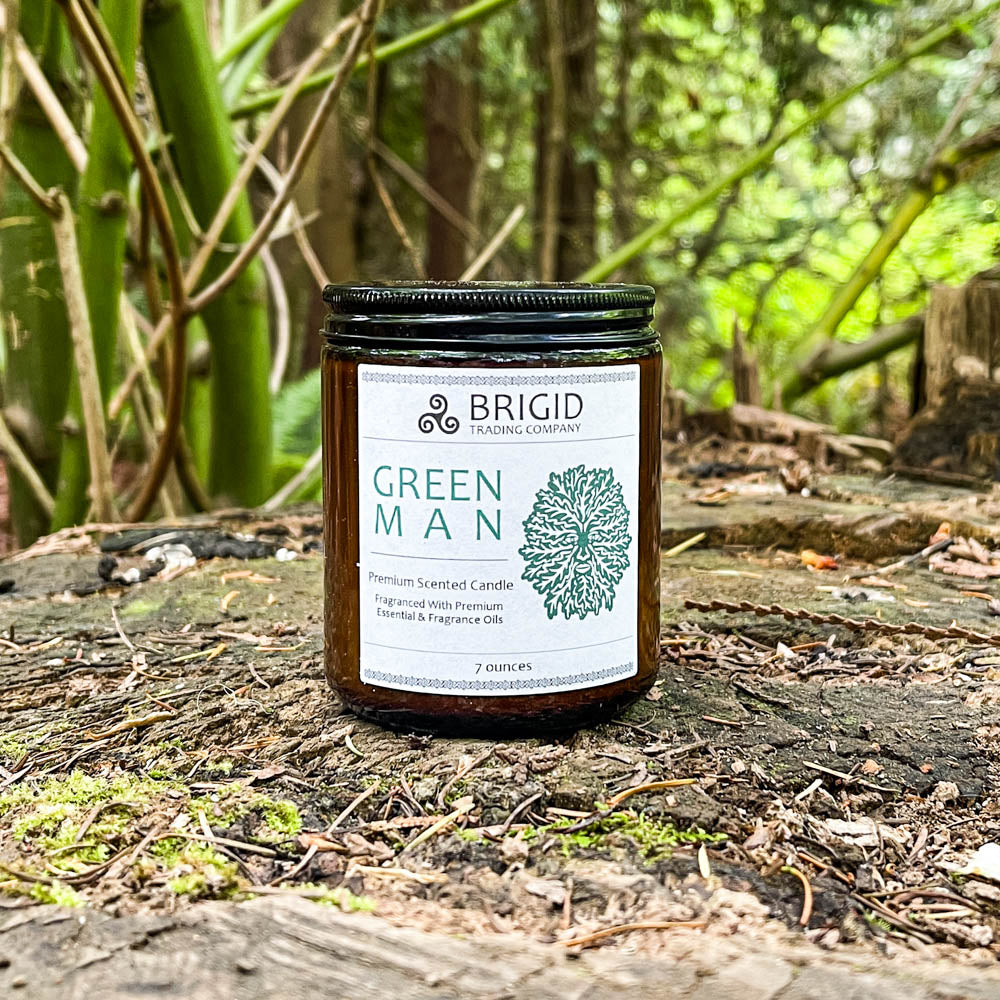 green man candles 7oz outside shoot glass jar original rainforest fresh scent with moss rainwater warm woods and musk celtic candles soy wax premium made in washington state hand made shown on tree stump