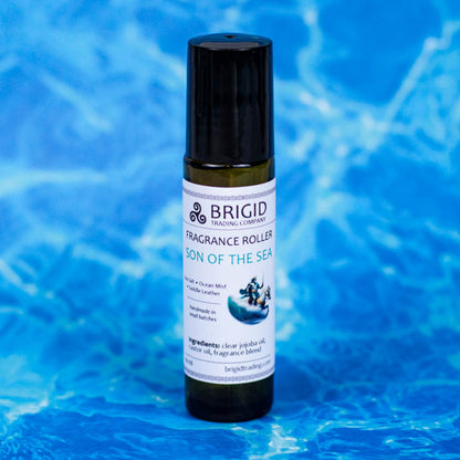 brigid trading company fragrance roller image studio photography by brigid trading company 2024 glass clear bottle with metal ball roller for perfume fragrance essential oil roller ball hand made by brigid trading company kitsap county washington state pacific northwest son of the sea ocean mist sea salt and saddle leather mananen mac lir the celtic god of the sea fragrance