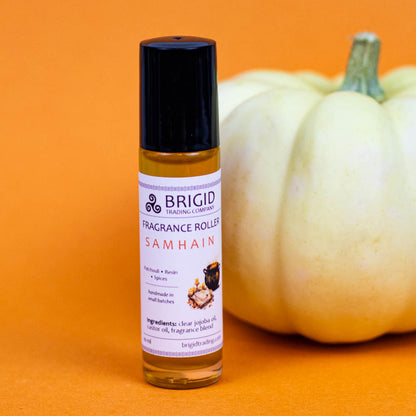 brigid trading company fragrance roller image studio photography by brigid trading company 2024 glass clear bottle with metal ball roller for perfume fragrance essential oil roller ball hand made by brigid trading company kitsap county washington state pacific northwest samhain patchouli resin and spices dragons blood halloween scent irish celtic themed holiday