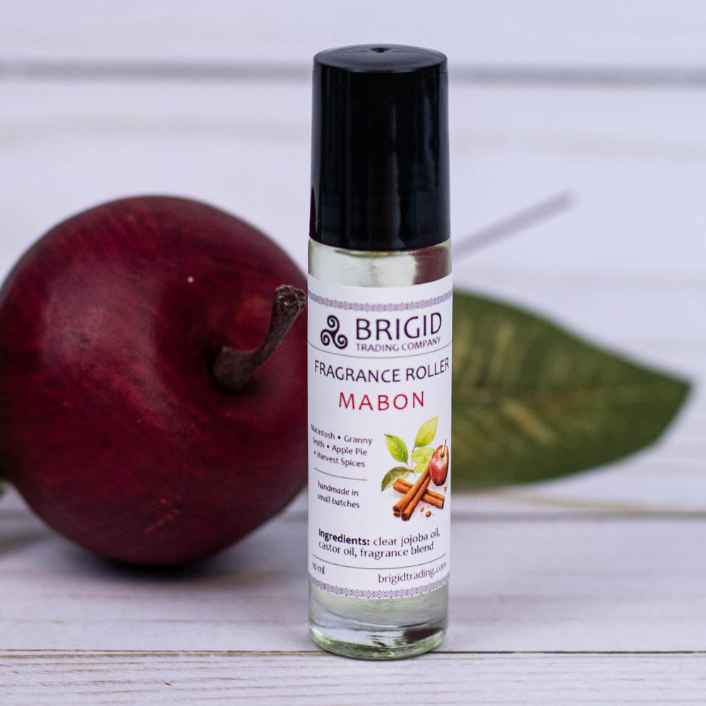 brigid trading company fragrance roller image studio photography by brigid trading company 2024 glass clear bottle with metal ball roller for perfume fragrance essential oil roller ball hand made by brigid trading company kitsap county washington state pacific northwest mabon fall scent macintosh granny smith apple pie and harvest spices