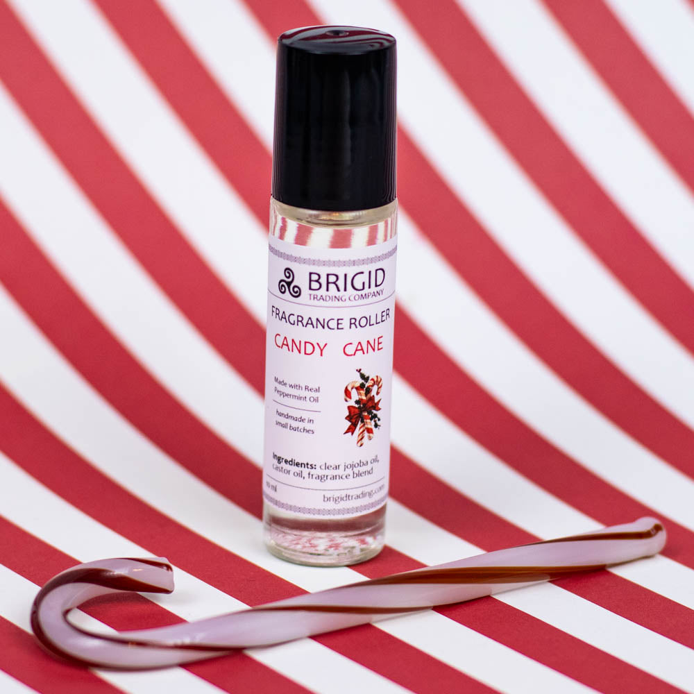 brigid trading company fragrance roller image studio photography by brigid trading company 2024 glass clear bottle with metal ball roller for perfume fragrance essential oil roller ball hand made by brigid trading company kitsap county washington state pacific northwest candy cane holiday christmas scents irish theme peppermint and candy fresh refreshing scents