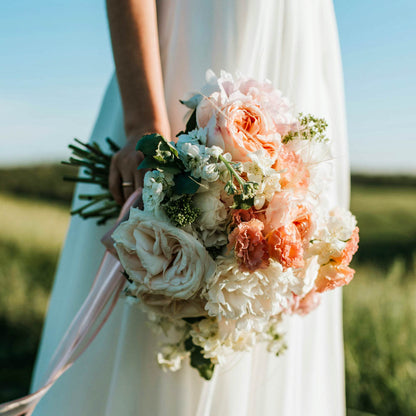 bride wedding the florist by brigid trading company bouquet roses and fine scents white gown made in kitsap county washington state brigid trading company