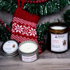 candy cane candles holiday background small and large candle small tin and large glass amber jar with holiday background stocking stuffers small gifts gift sets for aromatherapy lovers christmas xmas holidays yule winter solstice made in washington state kitsap county bremerton silverdale