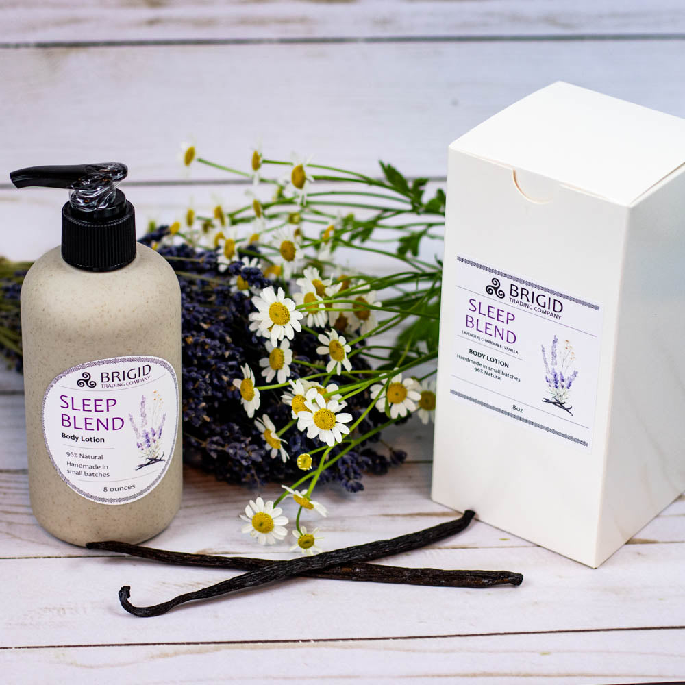 sleep blend natural body lotion made with real oils and butters no alcohol no irritants crafted by hand made in kitsap county washington state usa image shows lavender and fresh chamomile with vanilla beans and gift box shown with wheat straw packaging copyright 2024 by brigid trading company