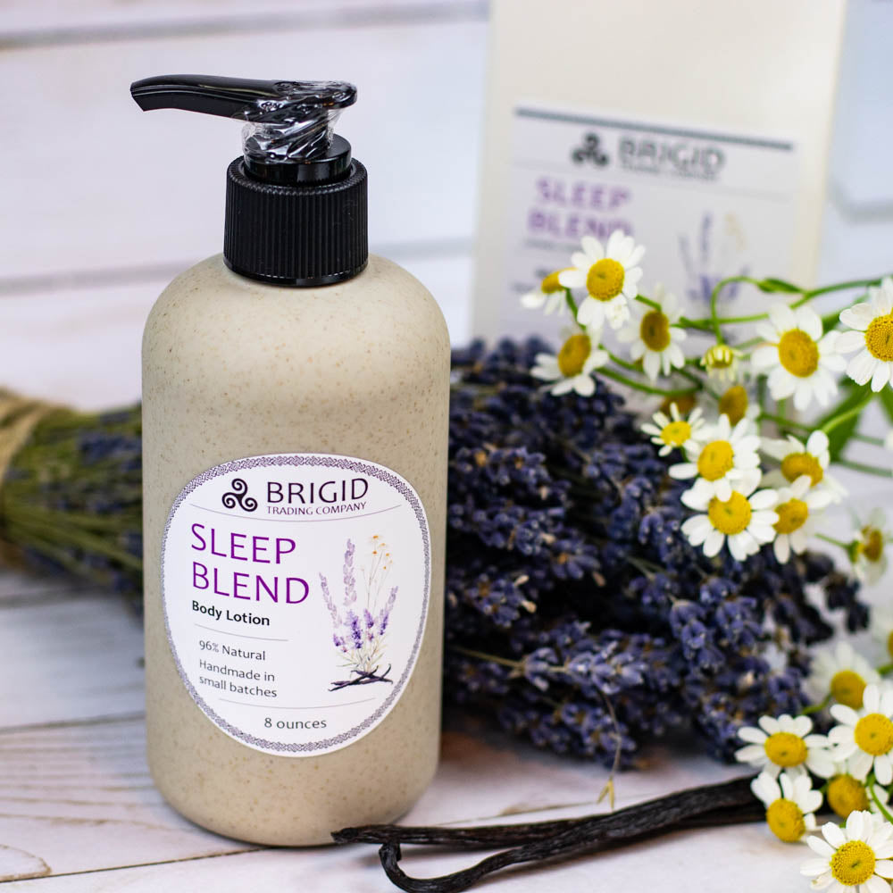 sleep blend natural body lotion made with real oils and butters no alcohol no irritants crafted by hand made in kitsap county washington state usa image shows lavender and fresh chamomile with vanilla beans and gift box in background with wheat straw packaging copyright 2024 by brigid trading company