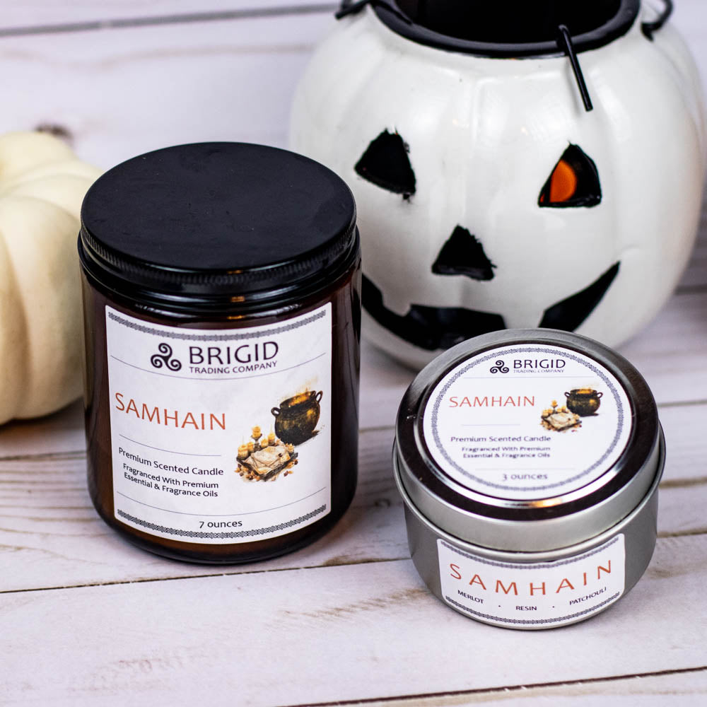 samhain premium soy wax candle celtic spirituality gifts Halloween 2025 premium scented candles from brigid trading company llc dragons blood resin merlot spices patchouli scent candles large and small handmade in washington state kitsap county white pumpkin jack-o-lantern in background wooden floor