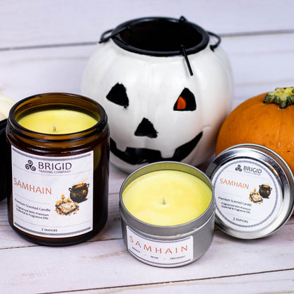 samhain premium soy wax candle celtic spirituality premium scented candles from brigid trading company llc dragons blood resin merlot spices patchouli scent candles large and small handmade in washington state kitsap county open candles showing yellow wax from dark resin fragrance oils