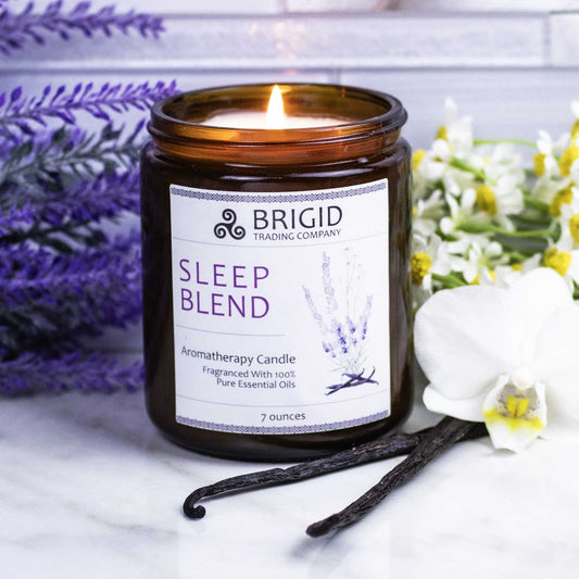 sleep blend aromatherapy candle hand poured with natural premium soy wax and essential oils of lavender chamomile and vanilla studio photography featuring props of ingredients and tile background bathroom or kitchen style by brigid trading company llc kitsap county washington state