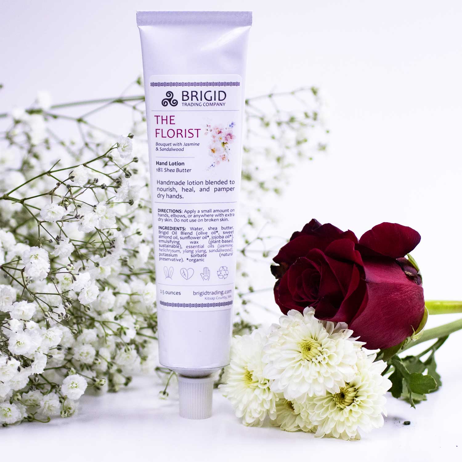 the florist hand lotion with a rose and white flowers studio photograph product photography light airy