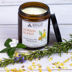 herbal blend aromatherapy candle handmade premium soy wax candle by brigid trading company llc made in kitsap county washington state usa us grown sustainable soy wax and essential oils only purifying scents for home refresh stale space funky smell defunk gifts for her gifts for him spring cleaning candle rosemary myrtle and frankincense scented cleansing smudge alternatives to purify home image shows original studio photography showing herbal blend soy wax candles large amber jar fresh rosemary resin