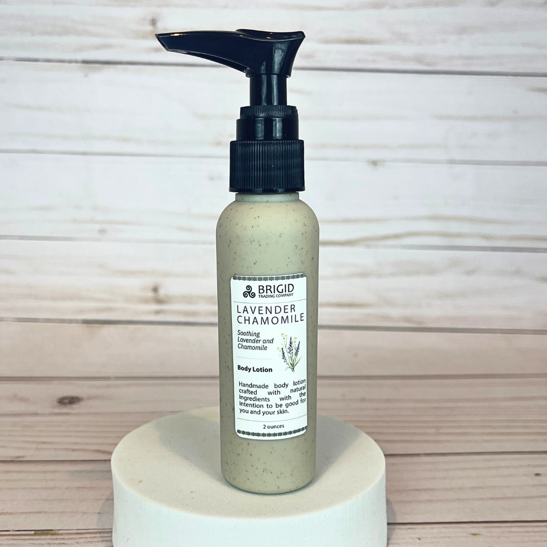 Bottle of Brigid Lavender Chamomile body lotion on a wooden surface eco friendly packaging wheat straw recyclable biodegradable natural lotion 2 ounce tsa friendly travel size