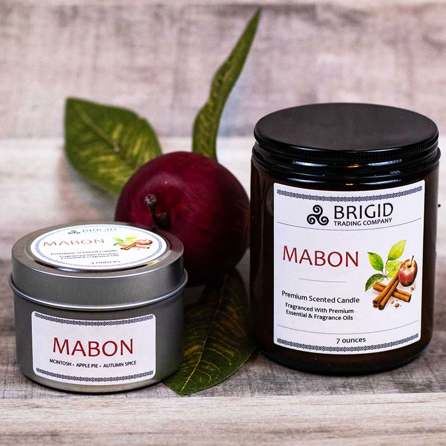 mabon fall scent apple cinnamon and spices thanksgiving fall natural soy wax candles hand made washington state by hand real people independent business essential oil natural organic image shows wood background with red apple and two candles