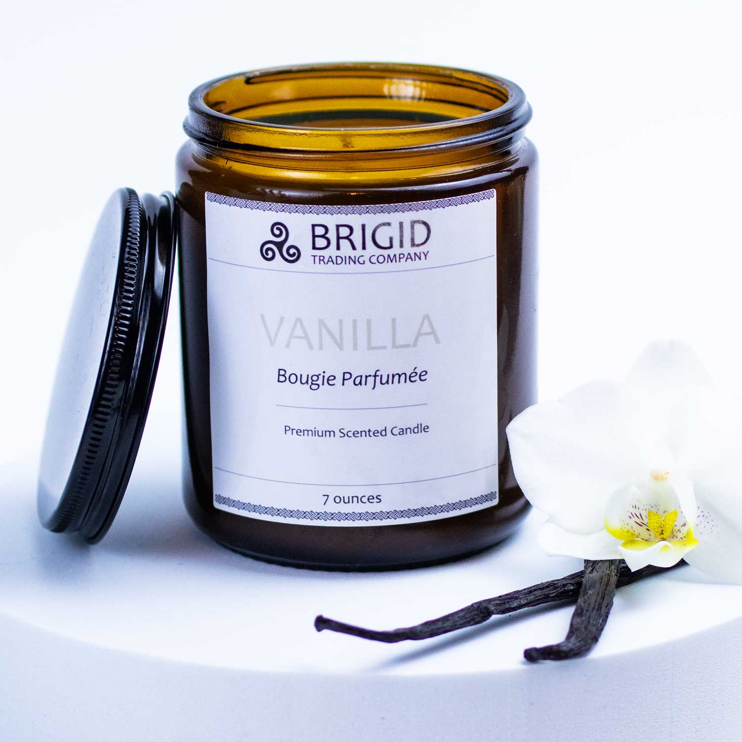 vanilla candle shot with vanilla pods accent studio image vanilla seven ounce candles natural hand made brigid trading company llc lip balm kitsap county washington state